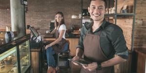 cafe owner using tablet pc
