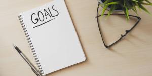 Notebook on table with "GOALS" written across the top