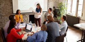 Businesswoman giving presentation at meeting