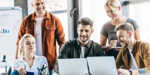 Group of young entrepreneurs around computers