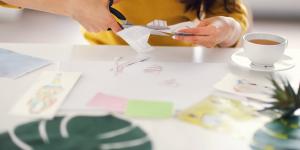 Woman cutting out images for vision board