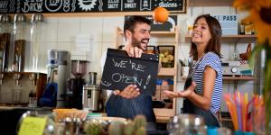 Man and woman opening their store