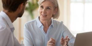 Senior woman business expert offers business mentoring to a younger man