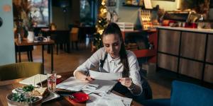 Restaurant owner going through her finances Restaurant owner going through her finances