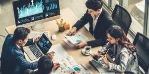 Discords, Decentralized Autonomous Organizations (DAOs), and the Importance of Communities in Web3 Group of investors sitting at table studying sales