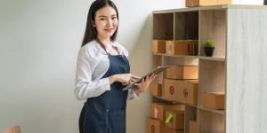 Find Similar Asian woman small business owner holding a tablet Find Similar Asian woman small business owner holding a tablet