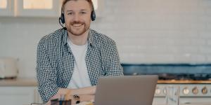 man hosting webinar with headset on man hosting webinar with headset on
