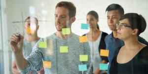 Business team planning on a glass board. Business team planning on a glass board.