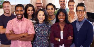 Portrait Of Staff Standing In Modern Design Office