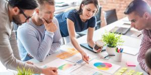 A group of people going over business plan