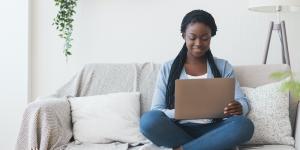 What you Need to Know About Google’s Algorithm Updates Black woman in braids sitting on couch with laptop computer