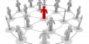 Photo of stick figures in a connecting circle, indicating networking