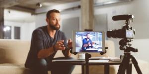 How Small Businesses Can Generate Traffic Without Spending Money on Ads man recording video in living space