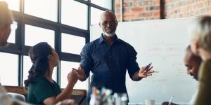 8 Ways to Make Your Business Proposal Stand Out man giving presentation
