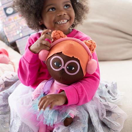 Young girl playing with a Surprise Powerz stem toy.