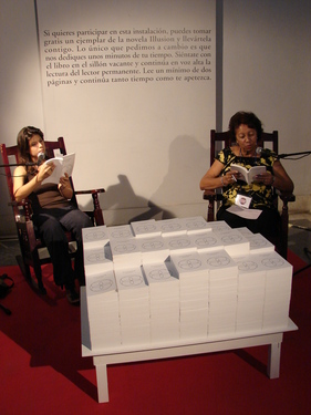 Project for 11th Havana Biennial, within the project Open Score, La Habana, Cuba.
From May 11 to June 11, 2012, Centro Hispanoamericano de la Cultura. Malecón 17 e/ Prado y Cárcel.
http://www.bienalhabana.cult.cu 

Illusion Reading Room is a participative installation: there is a pile of 500 copies of my novel Illusion and two armchairs. In one of them, a permanent reader is reading out loud from the novel. Public are welcome to take one copy of the novel with them for free. It is only asked to do one thing in exchange: to sit down in the vacant armchair and take it over from the reader, by reading out loud a few pages for the rest of the audience. In this way, public become part of the installation as temporary performers, and the novel is read continuously without interruption throughout the whole duration of the Biennial.  

