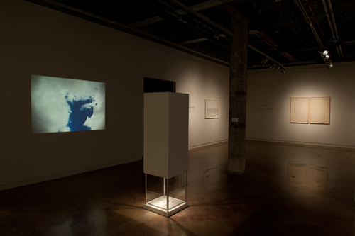 inverted pedestal, slide projector, slides, amplified sound, six empty bullet shells. 2012