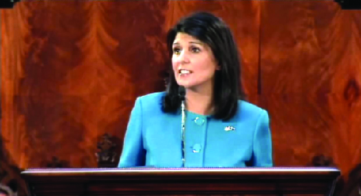 An image of Nikki Haley standing behind a podium.