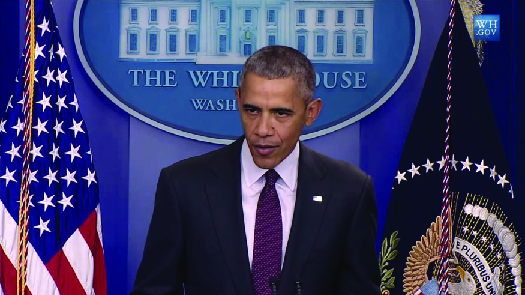 Photo shows President Obama giving a Press room briefing in the White House.