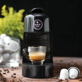 Cafetera de cápsulas. Café perfecto en segundos.