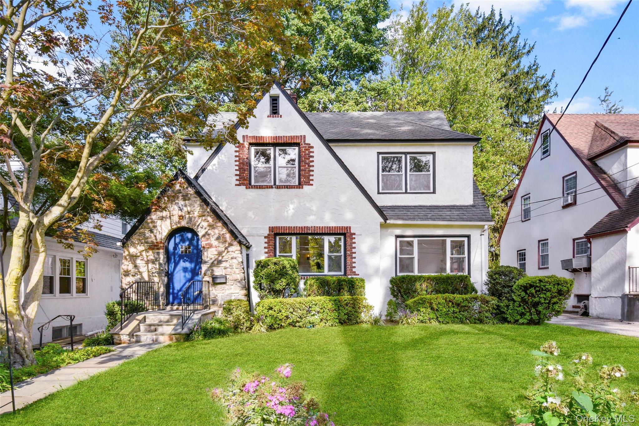 One of the Most Sought-After School Districts in the NYC Suburbs! Welcome to this storybook Tudor at 506 Siwanoy Place â€” a move-in ready home that puts you in the heart of Pelham. Nestled on a beautiful block right across from Siwanoy Elementary School and playground, youâ€™ll love the easy stroll to Four Corners Shopping, Huguenot Preschool, Pelham Middle and High Schools, and the train station (just 7 blocks away). With its cheerful blue front door, stone archway, and timeless Tudor details, this home has curb appeal in spades. Inside, youâ€™ll find sun-filled rooms, hardwood floors, modern farmhouse light fixtures, and fresh paint throughout. The flexible layout offers space to gather and grow, including a welcoming living room with a wood-burning fireplace, a sunroom, a kitchen with dining island and butlerâ€™s pantry, plus a convenient first-floor powder room. Upstairs, there are 3 spacious bedrooms and 2 full baths. Need extra space? The bright third-floor flex room and finished basement with laundry are perfect for a playroom, home office, additional bedroom or hangout spot. Outdoors, enjoy a landscaped front yard, a private level backyard, and a grilling patio for family barbecues. Thereâ€™s even a garage for added storage. Move in this October and get ready for fall foliage walks, Halloween fun, and all the year-round activities Pelham has to offer. As a Pelham Manor resident, you will also enjoy deeded access to the waterfront Shore Park â€” perfect for playdates, picnics, and summer afternoons. Welcome home to Pelham, where community life thrives! More photos coming tomorrow.