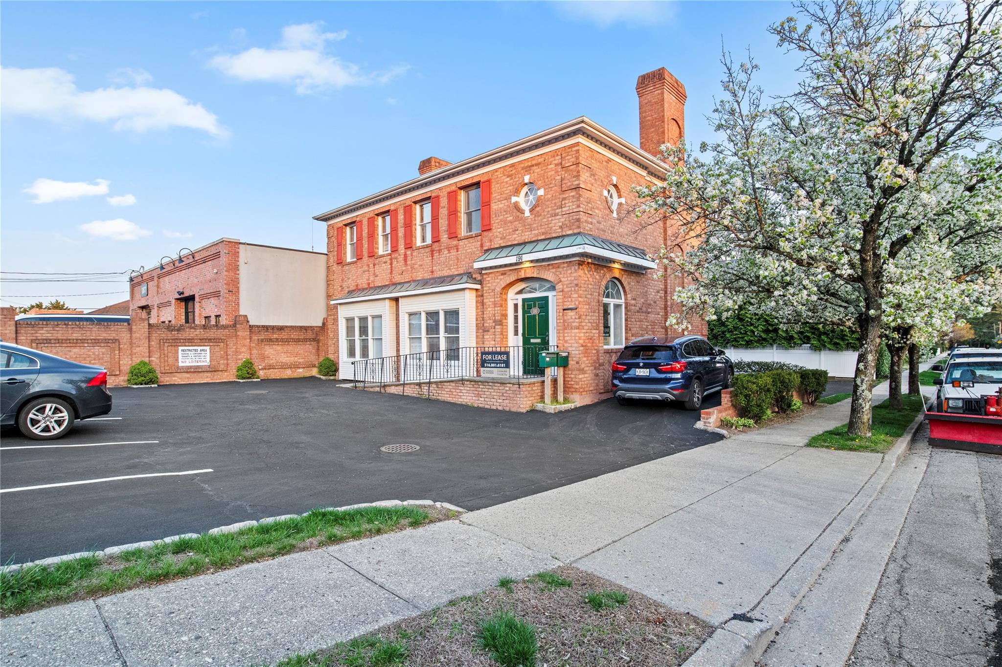 Turn-key office building for sale in the heart of Locust Valley at 191 Forest Avenue. This beautifully maintained brick property sits on a prominent corner lot and features a private parking lot with 11 spaces. The building includes a new 3-zone central HVAC system and offers fully finished space on the ground floor, second floor, and lower level. The lower level has its own private rear entrance, dedicated parking, and natural light from partial windows. Each floor is independently climate-controlled and metered, featuring bathrooms, windows, signage opportunities, and ample parking. Currently 33% occupied, the property presents a great opportunity for an owner-user or investor. Ideally located just 0.2 miles from the Locust Valley LIRR station, within walking distance to local shops and dining, and minutes from the Nassau Country Club, this prime office asset offers unmatched accessibility and charm in one of Long Islandâ€™s most desirable villages.
