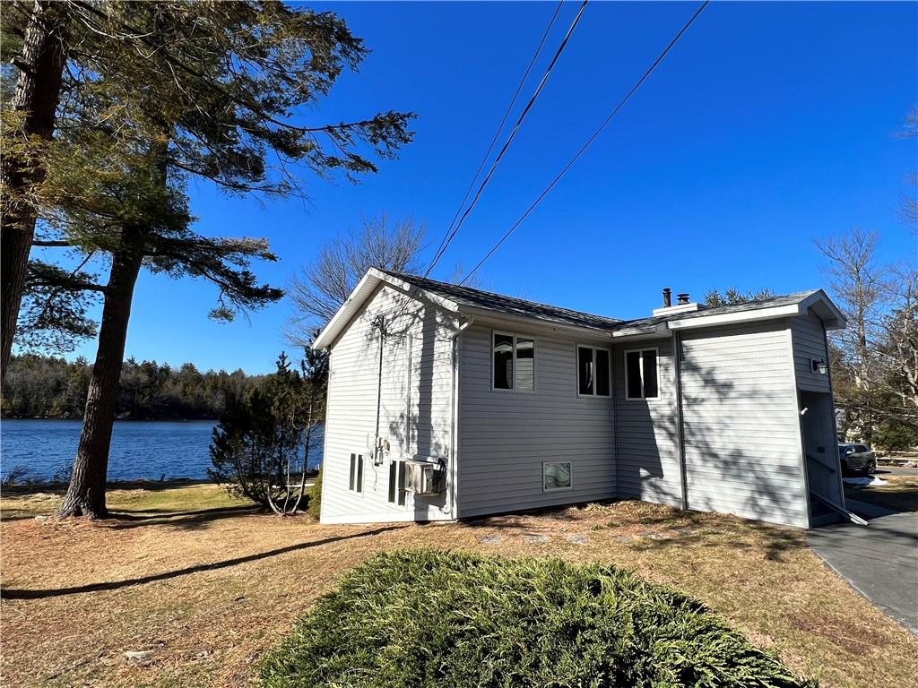 Fully Furnished Lake Front Cottage. This rental is on quiet Beaver Lake and a short drive to the sweet town of Rock Hill. The bottom floor encompasses a walk-out living area to the lake, a primary bedroom, and access to laundry. The main living floor contains the kitchen and dining area with gorgeous lake views, two spacious bedrooms and a bathroom. Enjoy swimming, kayaking and fishing! Close proximity to eateries, grocery stores, and hiking trails! This location gives easy access to breweries, gaming, concerts, water park and provides the perfect place to hang your hat to relax. Additional Information: Heating Fuel: Oil