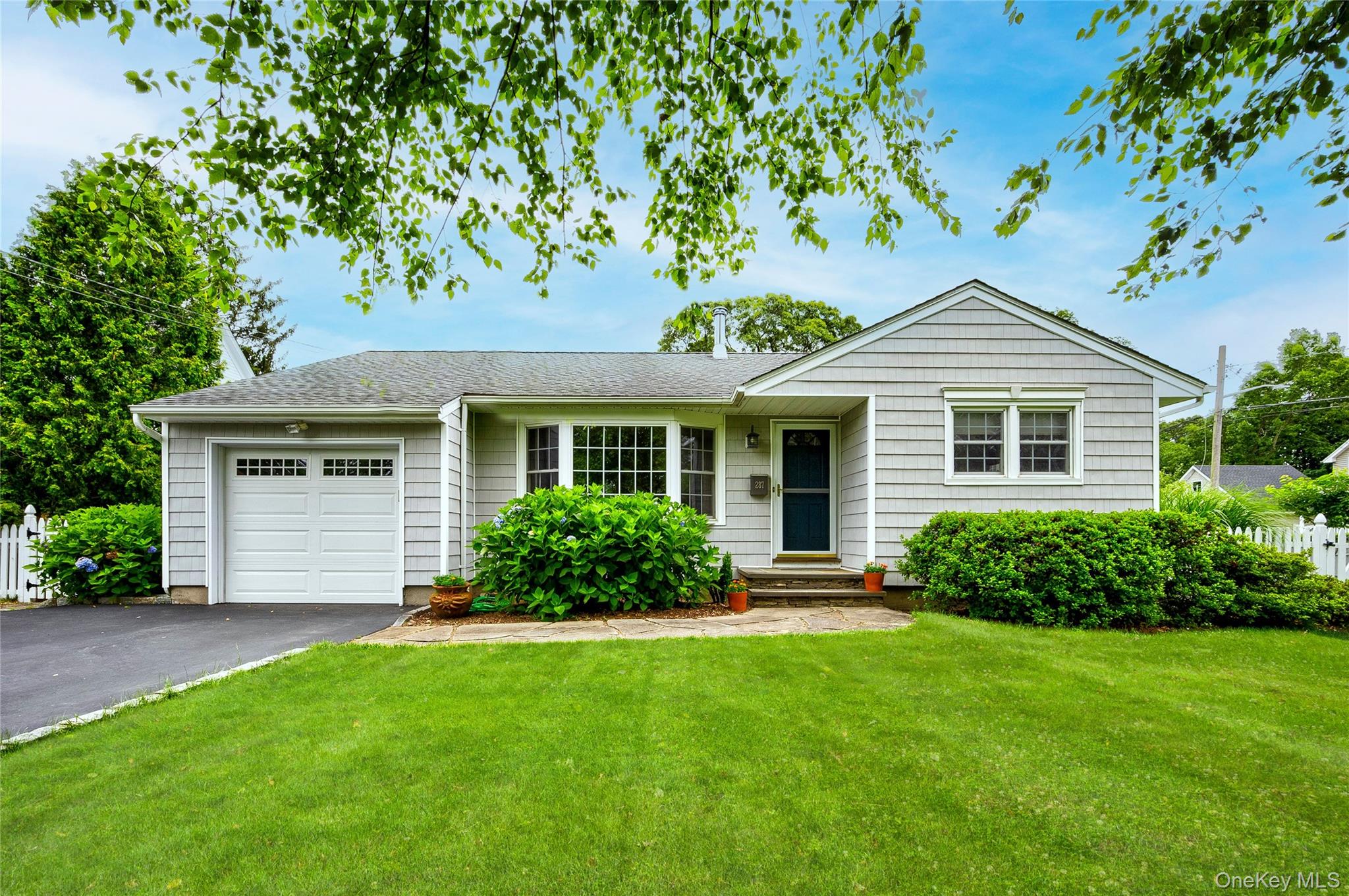 Welcome to this charming ranch-style home nestled in the heart of Saint James, NY. Offering three spacious bedrooms and one beautifully updated full bath, this residence combines comfort, functionality, and convenience on a desirable quarter-acre lot. With reasonable taxes and a prime location close to transit, schools, and shopping, this property is perfect for both first-time buyers and those looking to downsize without sacrificing amenities.Step inside to find an inviting layout highlighted by gleaming hardwood floors, a warm dining area, and a spacious kitchen with granite countertops and stainless steel appliances. The sun-filled rooms create a bright, welcoming atmosphere, while the recently updated bath adds a touch of modern style. A cozy 4-seasons room extends the living space and offers the perfect spot to enjoy your morning coffee or unwind with views of the backyard gardens.This home also delivers outstanding practicality with a full basement featuring high ceilings, abundant storage, and a laundry area. Two-zone gas baseboard heating and central air provide year-round comfort. An easy-access attic provides even more storage options, while central vacuum adds everyday convenience. Owned solar panels keep utility costs low and support sustainable living.Outdoors, the property truly shines with a flat, fenced yard perfect for pets, entertaining, or gardening. A stone patio, storage shed, and landscaped gardens complete the space, offering both beauty and functionality. The one-car attached garage provides added ease and security.Combining timeless charm with thoughtful updates, this home presents an excellent opportunity to live in one of Long Islandâ€™s most beautiful communities. Donâ€™t miss your chance to experience all that this Saint James ranch has to offer.