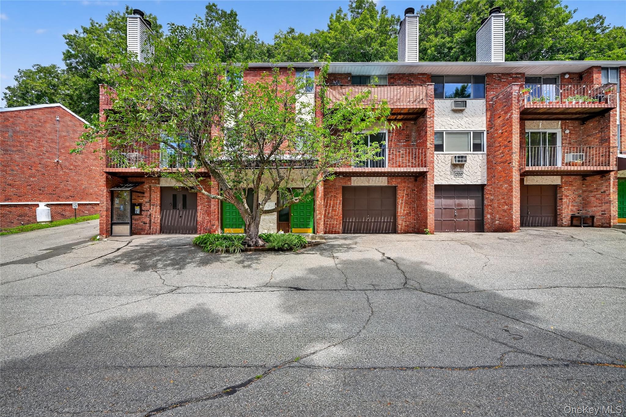 Welcome to 1203 Parkview Drive, a charming condominium nestled in the serene setting of the Tuxedo Heights community. This cozy one-bedroom, one-bathroom home offers modern comforts and stylish living. The well-appointed kitchen boasts stainless steel appliances, while the living area features elegant wood floors, wood burning fireplace, private balcony, and deck perfect for relaxation. In building laundry. Convenient parking for you and your guests.