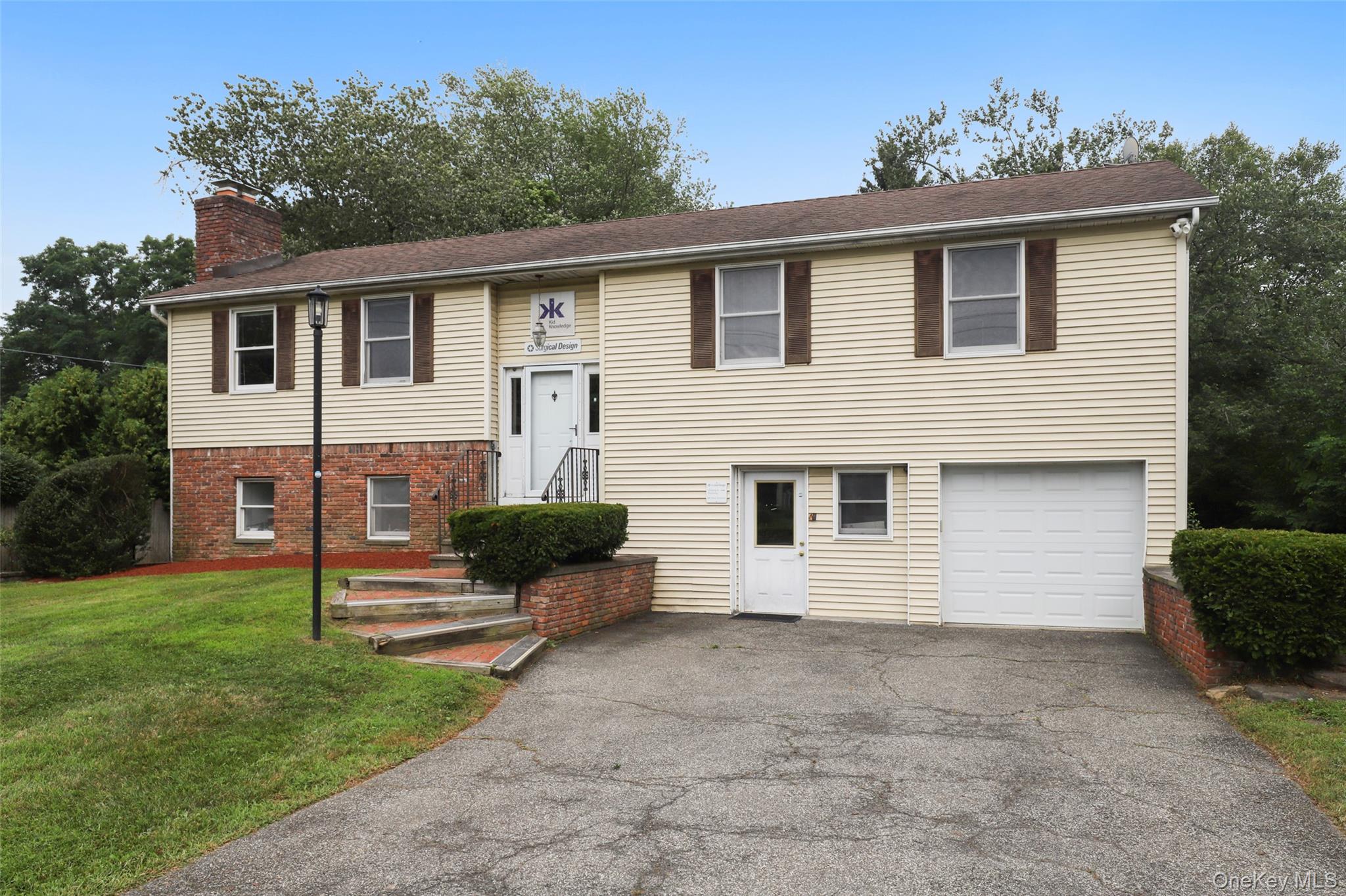 Professional business office in a prime location that is on the same street as two schools and a block away from Armonk town center. The two-story building can be used as one 2268 SF space or can be separated into two distinct spaces. The upper level has 4 separate offices plus a main room that can accommodate up to 4 desks, a kitchen and bathroom.The lower level has separate entrance and a large room that can accommodate several desks, a storage room, bathroom, a shipping and receiving area and a one car garage. There are also proposed plans by JMC to build a new larger 4000 SF building. Zoned PBO with large parking lot,  3 phase electric, LED lighting, and two full bathrooms