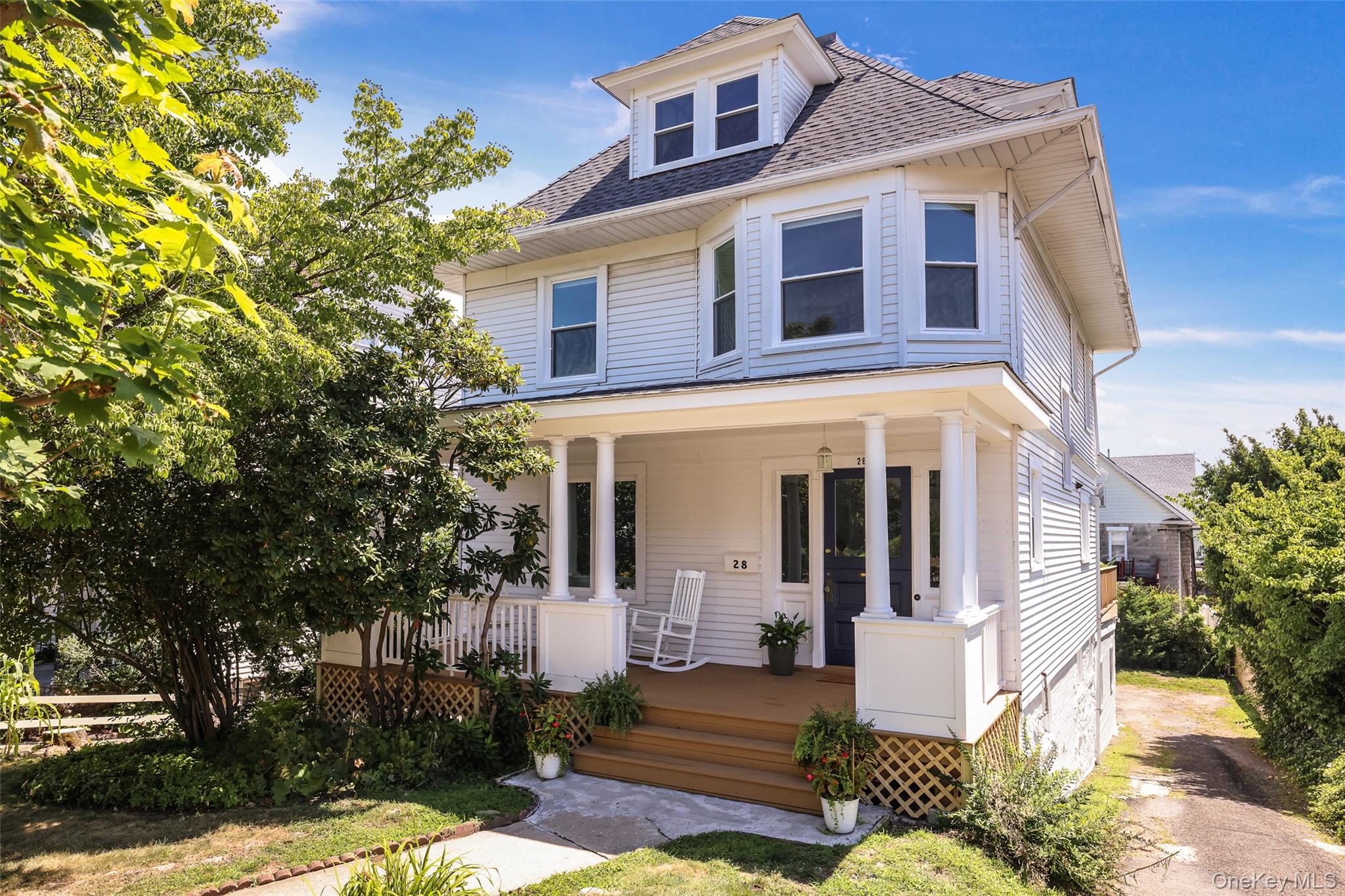 A picture postcard beauty , the house was fully renovated in 2022 from top to toe. nestled on a tree lined street, leave the car at home, walk to town and train in minutes and enjoy close proximity to schools and parks. An oasis of calm set high on a rise with a leafy front porch affording privacy to the street and an over sized sun drenched deck for entertaining. Inside, a beautiful fluidity, new windows brimming with natural light, rich period detail and original wood floors elegantly restored. Easy living from the eat in kitchen that opens onto the deck, to the open plan dining and living rooms with views to the garden at the front. A stylish brand new powder room completes the first floor. On the second floor-four sunny bedrooms, new marble bathroom and access to the walk up unfinished huge attic space. Fabulous finished all new walk out lower level, space for the family room, space for office/gym, full bathroom, laundry area. Plus new roof, new HVAC, new insulation, tons more features. Double garage, fenced back yard, long driveway to park many cars. PLEASE NOTE the FINISHED LEGALIZED sq footage is actually 1843 sq ft following the 2022 renovation.
