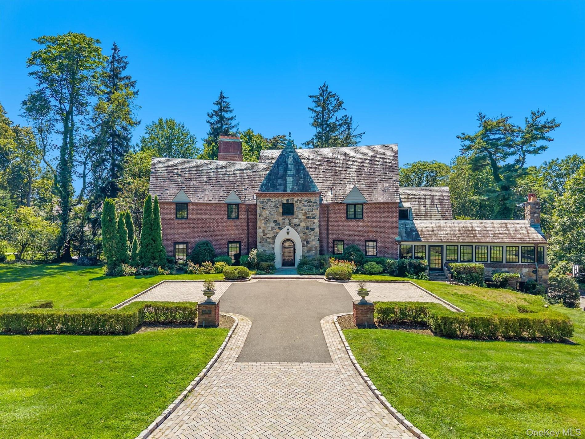 Step into timeless elegance with this one-of-a-kind Tudor residence, perfectly situated in the highly coveted gated community of Kennilworth in Kings Point. This home has been thoughtfully and meticulously restored and renovated, combining the architectural charm and craftsmanship of a bygone era with todayâ€™s most sought-after modern luxuries. The first floor showcases a grand entry foyer, expansive entertaining rooms, including an oversized living room bathed in natural light, a formal dining room ideal for gatherings, and a grand family room anchored by a striking stone fireplace and a wood panelled library. The centerpiece of the main level is the brand-new, state-of-the-art chefâ€™s kitchen, designed with premium finishes, high-end appliances, and abundant workspaceâ€”truly a dream for any culinary enthusiast. A private office/bedroom with full bath and an elegant powder room complete the main floor. Upstairs, the home continues to impress with its airy and spacious layout. The oversized primary suite offers a serene retreat with a luxurious en-suite bath. Three additional bedrooms, each generously sized, are accompanied by two more full baths, ensuring comfort and privacy for family and guests alike. The full finished lower level extends the living space, featuring a large playroom, maidâ€™s quarters with full bath, laundry room, and ample storage.Outdoors, the lushly landscaped backyard provides a tranquil escape, with a verdant lawn and mature plantings creating the perfect setting for gatherings, al fresco dining, or quiet relaxation. Kennilworth residents enjoy access to a private waterfront pool and a manned security gate.