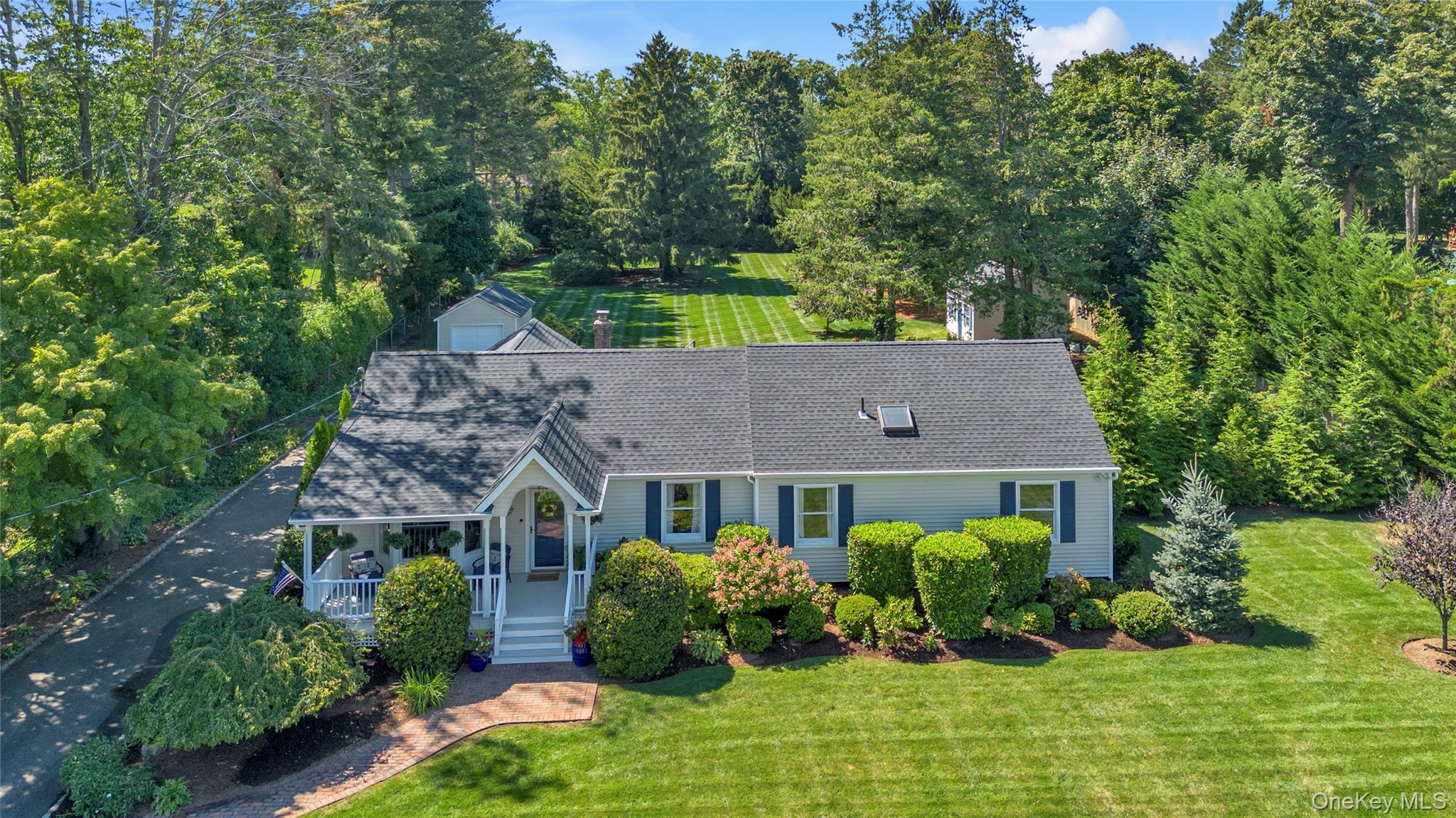 Charming Updated Ranch on 1 Acre in Harborfields School District!This 4-bedroom, 2.5-bath ranch sits on a beautifully landscaped, level 1-acre property in the heart of the Harborfields community. A welcoming front porch leads to the sun-filled living room with vaulted ceiling and bay window. The updated eat-in kitchen with stainless steel appliances and gas cooking flows into the dining room, highlighted by walls of windows overlooking the magnificent fenced backyard. The primary suite features an updated bath, complemented by three additional bedrooms and a skylit hall bath. The lower level provides additional versatile space, while outside a rear patio and expansive yardâ€”perfect for entertaining, play, or even a future poolâ€”create the ultimate retreat. A detached one-car garage and oversized storage shed add convenience. Ideally located near Greenlawn Village, residents enjoy easy access to parks, shopping, dining, and the train station. A perfect blend of comfort, style, and location!