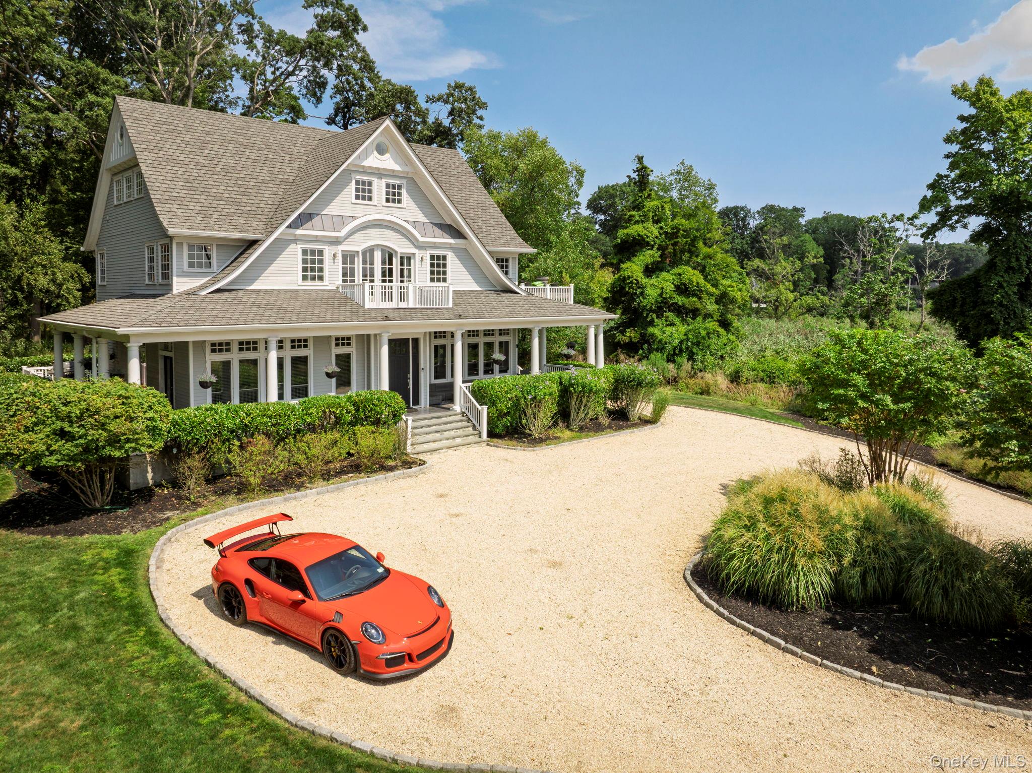 Enjoy spectacular 180&#176; water views and timeless Hamptons style at Harbor Lights, a nine-year-old custom home perched on the shores of Lloyd Harbor. Combining classic architectural charm, modern high-efficiency systems, and a prime, close-to-town location, this home delivers beauty, practicality and easy living. The approach begins with a pebbled courtyard leading to a wraparound porch that welcomes you to relax with the harbor breeze while soaking in those gorgeous views. Step inside to 10-foot ceilings on the main and second floors, oversized windows, and mahogany French doors flooding the interiors with natural light. Brazilian Walnut floors and detailed millwork carry a sense of warmth and elegance throughout.The main level features gracious living and dining rooms, a chefâ€™s kitchen with floor-to-ceiling cabinetry and top-tier appliances, and a cozy den with fireplace opening to a large deck. A sun-filled first-floor bedroom with full jacuzzi bath doubles as an office with its own porch accessâ€”ideal for receiving guests or clients.Upstairs, the primary suite is a luxury retreat, including a spa-like bath with steam shower, jacuzzi, and Italian tile finishes, a walk-in closet with custom built-ins, and arched French doors leading to a private balcony. Three additional bedrooms and a convenient laundry area complete the second floor. The dramatic third floor, finished with soaring ceilings and gleaming shiplap, offers space for a gym, playroom, office, or additional storageâ€”all filled with natural light and spectacular views.The basement provides yet more versatility with a partially finished walkout, abundant storage racks, workshop area, and large utility sink. A modern high-efficiency gas boiler paired with whole-house foam insulation keeps annual propane costs impressively low, typically under $2, 000.As part of the prestigious Lloyd Neck Estates Association, residents enjoy a private beach with neighborhood events like lobster bakes and barbecues, and access to Lloyd Harborâ€™s residents-only tennis, pickleball, volleyball courts, playground, lifeguarded swimming, showers, and a beloved summer camp with sailing, water skiing, and tennis. This private paradise is just a short ride from Huntington Village, known as Long Islandâ€™s premier downtown, with over 100 restaurants and bars, boutique shopping, live entertainment at the Paramount Theater, a six-screen cinema, and festive parades year-round.Harbor Lights offers unmatched elegance, efficiency, and communityâ€”waterfront living at its very finest.