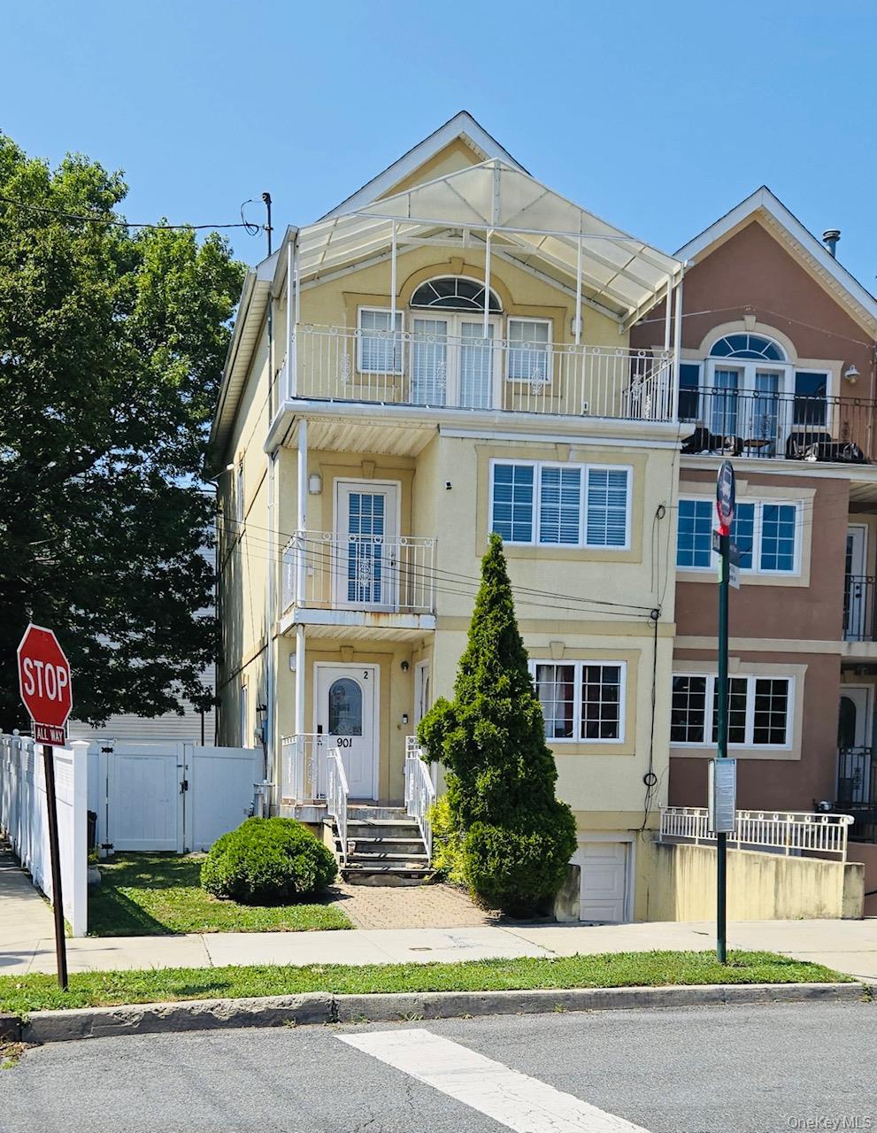 Welcome to 901 Dean Ave, great sized corner 2 family home.  Home features, 3 bedrooms Over 2 bedrooms, Over a finished walkout basement. Home is nicely updated with Central Air conditioning. Top floor offers 3 bedroom&rsquo;s 2 1/2 bath Duplex with vaulted ceilings and In Unit Bath in addition two balcony&rsquo;s with water views, In UNIT washer and dryer. The 2 bedroom unit has 2 FULL bath with backyard access from unit, nice size Living and dining areas great for Entertaining. Basement is updated, walkout. Parking for 1 car with garage and Additional washer and dryer in the garage. Steps from NYC bus services. No flood Ins Needed