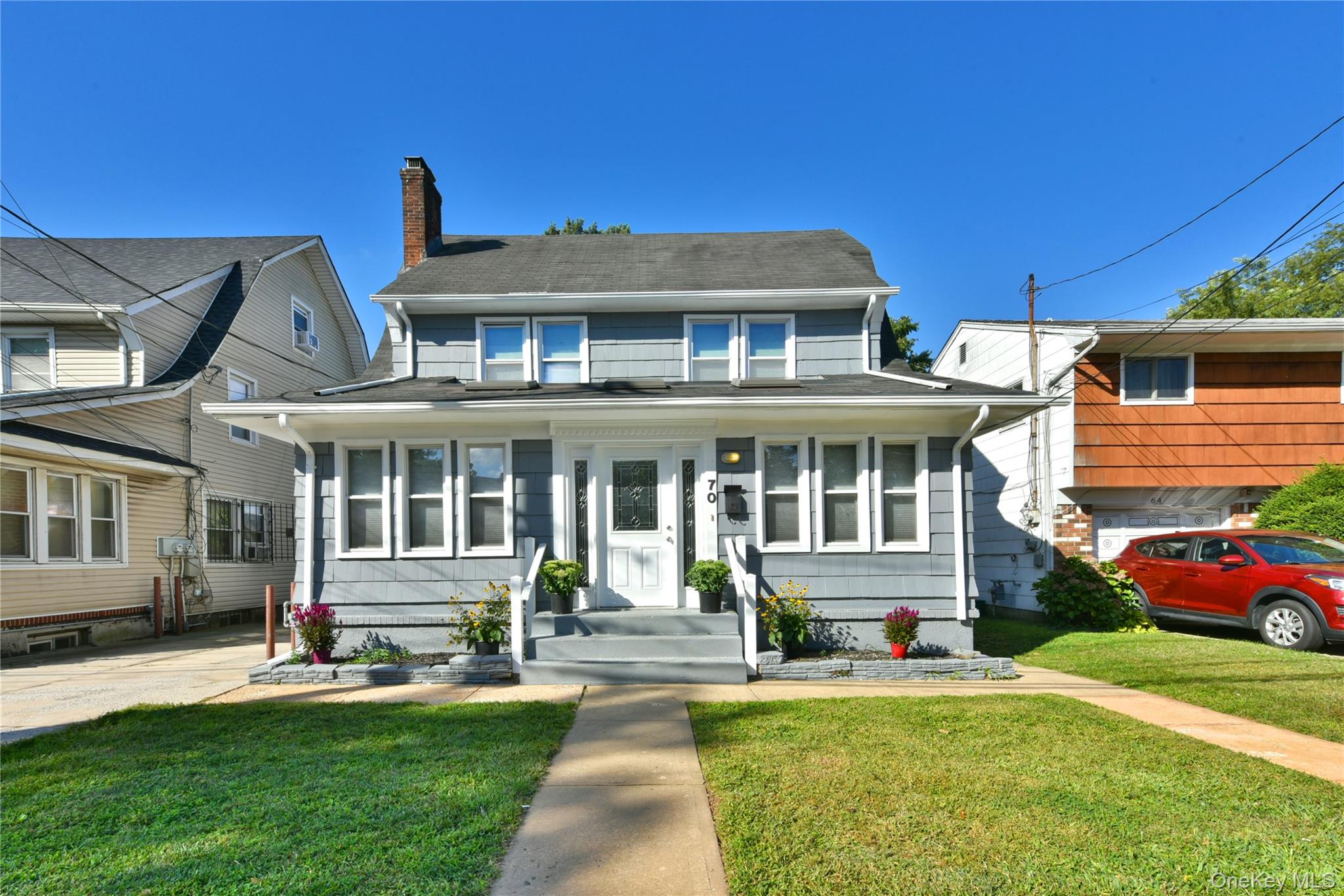 Stunning Colonial home which features 3-4 bedrooms and 3 full baths. The main level of the house flows with an skylit entry foyer that leads to a beautiful living room with a fireplace, and a dining room, with hardwood floors throughout. There is an eat-in-kitchen with stainless steel appliances. The second floor boasts 3 bedrooms (including the primary with a walk-in closet) and one full bath. The third floor is a full, finished walk-up attic, which can be used as a bedroom. The basement is finished with an outside entrance. There is a detached 2.5 car garage, beautiful rear deck, and a fenced yard. This home is a must see. Conveniently located near shopping, schools and restaurants.