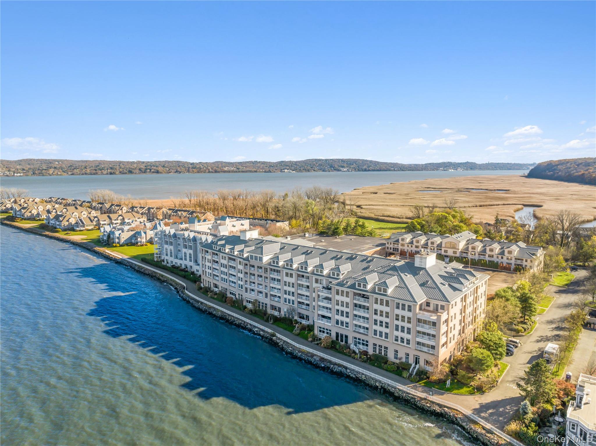 Waterfront Penthouse, Piermont, NY! Located in the area&rsquo;s only Gated Waterfront Community, this Luxury DUPLEX offers nearly 2, 100 square feet of sunlit living space. With Four-Season views of Tallman Mountain State Park and the Hudson River, this Penthouse boasts 2 principal bedroom suites, a deck, 2.5 baths, and 2 walk-in closets--one of which is 8 x 18 feet! Additional features include an expansive, open-concept Living-Dining Room with hardwood floors, gas fireplace, and deck access. The adjacent kitchen is well-equipped with granite counters, stainless steel appliances, and a large, walk-in pantry for additional storage. The 1st floor Primary Bedroom features a marble bath with dual vanity, soaking tub, and separate walk-in shower. A pocket door leads from the Bedroom to a separate closet office. The spacious upstairs Primary Suite features a comfortable sitting room with Stunning Views of the Hudson River and Tallman Mountain State Park. The upstairs en suite suite marble bath has a dual vanity, jetted tub, and separate walk-in shower. You&rsquo;ll fall in love with the extraordinary 8 x 18&rsquo; walk-in closet with generous space for all your more personal possessions! A private laundry/utility room and a downstairs powder room completes the layout. Residents enjoy a number of luxury amenities, including Concierge and Porter services and Membership in the Private Health Club with indoor, heated pool, spa, gym, and tennis & pickelball courts. 417 Harbor Cove also comes with indoor parking for 2 cars and a storage unit. Nearby, enjoy the charming Village of Piermont restaurants, shops, galleries, and marina. There&rsquo;s a reason why Piermont is a weekender&rsquo;s much-loved destination! Ideally located only 15 miles from New York City, make this home your perfect Weekend Retreat, 7 days a week. Convenient transportation to New York City leaves directly from the village.