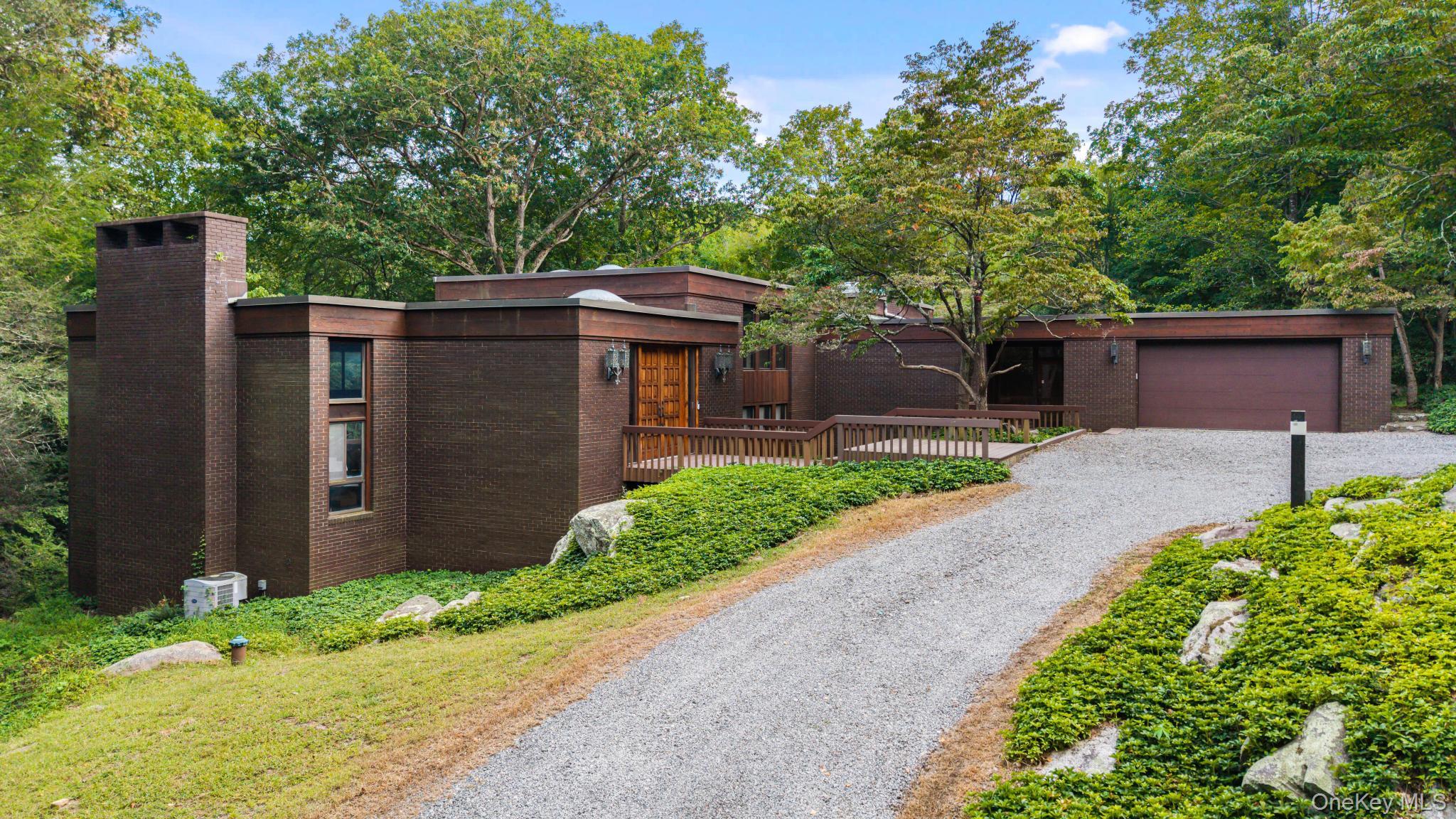 An Heirloom Home Like No Other â€” Offered to the Public for the Very First Time. This remarkable mid-century modern residence, lovingly crafted by its original owner and cherished by the same family for generations, is now available for the first time. Built with care and vision, it reflects both architectural character and a legacy of love that is rarely found. Inside, light pours through expansive windows, creating a natural connection to the outdoors and filling the open living and dining spaces with warmth. The recently updated kitchen with stainless steel appliances balances functionality with timeless style, ideal for both everyday living and entertaining. Four oversized bedrooms provide generous comfort, with the primary suite offering abundant sunlight and a serene sense of retreat. Throughout the home, thoughtful details and tasteful updates highlight its original design while enhancing livability for the modern lifestyle. Set on 5.9 wooded acres, the property is a true oasis. Mature trees, natural surroundings, and the gentle quiet of the landscape offer seclusion and peace, yet the home remains only moments from Bedfordâ€™s charming town center and shops. The balance of privacy and convenience makes this residence uniquely special. Rarely does a property of this kind come to marketâ€”one that blends timeless architecture, family history, and an irreplaceable setting. It is an invitation to step into a home built with love, preserved with care, and ready for its next chapter.