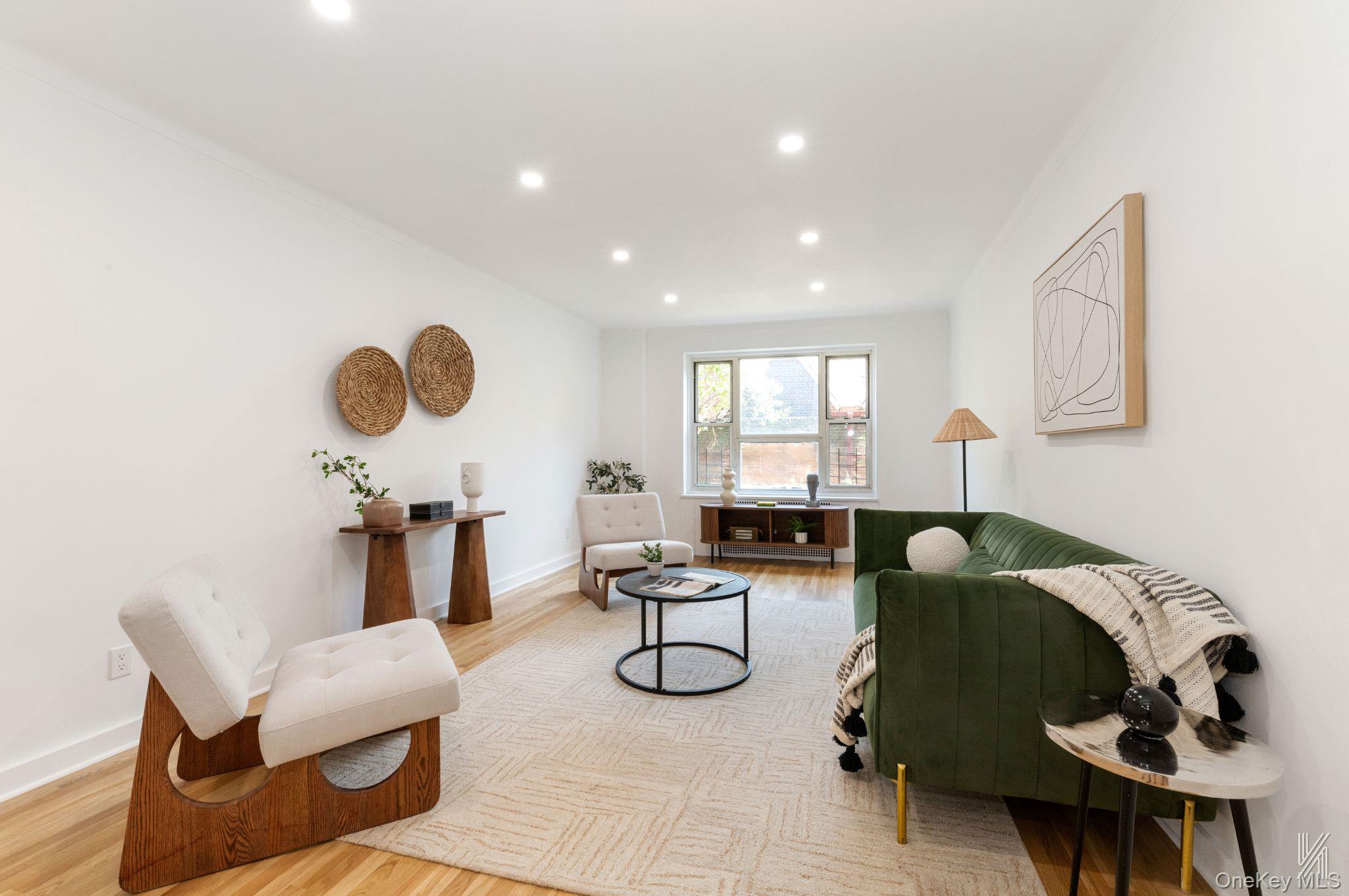This fully renovated, pin-drop quiet one-bedroom Co-op has one of the most coveted floor plans in The Carlton House. Inside, crisp white tones, recessed lighting, and gorgeous hardwood flooring cascade across the foyer, which can serve as a home office or formal dining area. Thereâ€™s also a large coat closet and an updated Comelit Wi-Fi security system that works with Alexa and HeyGoogle.The original oak floors have been lovingly restored throughout, and a flood of sunlight invites you into the spacious living room. Entertain guests or enjoy a cup of coffee with east-facing, unobstructed garden views. If you enjoy a quiet Sunday afternoon, feel free to curl up with a good book, as the unit provides a reprieve from outside noise.The tasteful renovations continue in the eat-in kitchen, perfect for the avid chef. The windowed space is a chef&rsquo;s delight, featuring sleek shaker cabinetry, two expansive quartz countertops for preparation, and premium stainless-steel appliances. This includes a refrigerator, dishwasher, five-burner gas stove, and an oven with a microwave above. The lovely dining area features built-in shelves and two garden-view windows.Retreat to the king-sized bedroom, which is located past the bathroom and hall linen closet for added privacy. Itâ€™s truly a serene haven with four double-pane windows that provide abundant natural light throughout the day. A spacious closet with double sliding doors enhances functionality and storage.The spa-inspired bathroom is a testament to modern luxury, with a glass shower/tub combo, floor-to-ceiling tiles, and contemporary Delta fixtures. The mirrored medicine cabinet has three stylish light fixtures above. Storage is not an issue as thereâ€™s clean white cabinetry underneath the sink. The Carlton House is a distinguished mid-century modern cooperative nestled in the heart of the historic district of Jackson Heights. Living here means you have exclusive access to community perks such as a part-time doorman, a well-equipped gym, a private garden, laundry facilities, and a garage with a short waiting list. When you venture out, you can easily explore the area&rsquo;s many cafes, shops, restaurants, supermarkets, and schools. Its proximity to the train station allows for an easy commute to the rest of the city. With the maintenance being only $818.28 per month, this residence offers the best of Jackson Heights living.