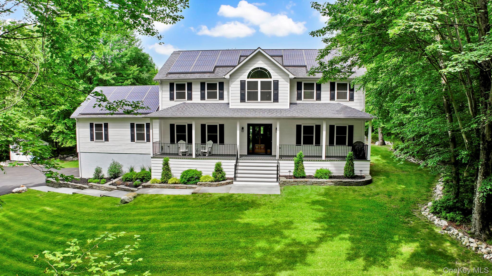 Welcome to this beautiful 4-bedroom Colonial nestled on 5.5 serene acres with seasonal views, offering the perfect blend of privacy, charm, and modern convenience. A long, paved driveway (2022) that offers generous parking and guides you through a professionally landscaped approach, beautifully accented with natural bluestone and ambient dusk-to-dawn sensor lighting. The inviting Trex rocking chair front porch and striking new Pella front door/windows (2019) create a memorable first impression, giving you a glimpse of the comfort and style inside. Step into the inviting foyer with new tile flooring (2025) and continue into the heart of the home- a fully renovated kitchen featuring granite countertops, a center island with bar seating, abundant cabinetry, and a stylish backsplash. Sliding glass doors (2019) open to a spacious Trex deck with solar caps and a retractable awning with dimmable lights(2021) ideal for entertaining or enjoying peaceful outdoor moments as you relax in your above-ground oxygen pool. The open-concept flow between the kitchen and the living room, complete with a classic wood-burning fireplace, makes hosting effortless. A formal dining room with gleaming wood floors offers space for memorable gatherings, while a separate front room is perfect for a home office or guest room. Just down the hall from the kitchen leads to a versatile bonus room equipped with a ductless heating and cooling system (2021), new flooring (2025)â€”ideal for extended family, a playroom, or a private work-from-home space/business, which connects with the lower level basement area that is partially finished. The upper level boasts a generously sized primary suite with tray ceilings, a spa-like en-suite with a Jacuzzi tub, and a walk-in closet. It also features three generously sized bedrooms with ceiling fans and plush carpeting, as well as a full hall bath. New furnace (2024). Resorts World Catskill Casino, Kartrite Indoor Water Park, Legoland, Sam&rsquo;s Point Hiking, Minnewaska, Mohonk Mountain House, Angry Orchard, Restaurants, Breweries, Wineries and more! Within 1.5 to NYC