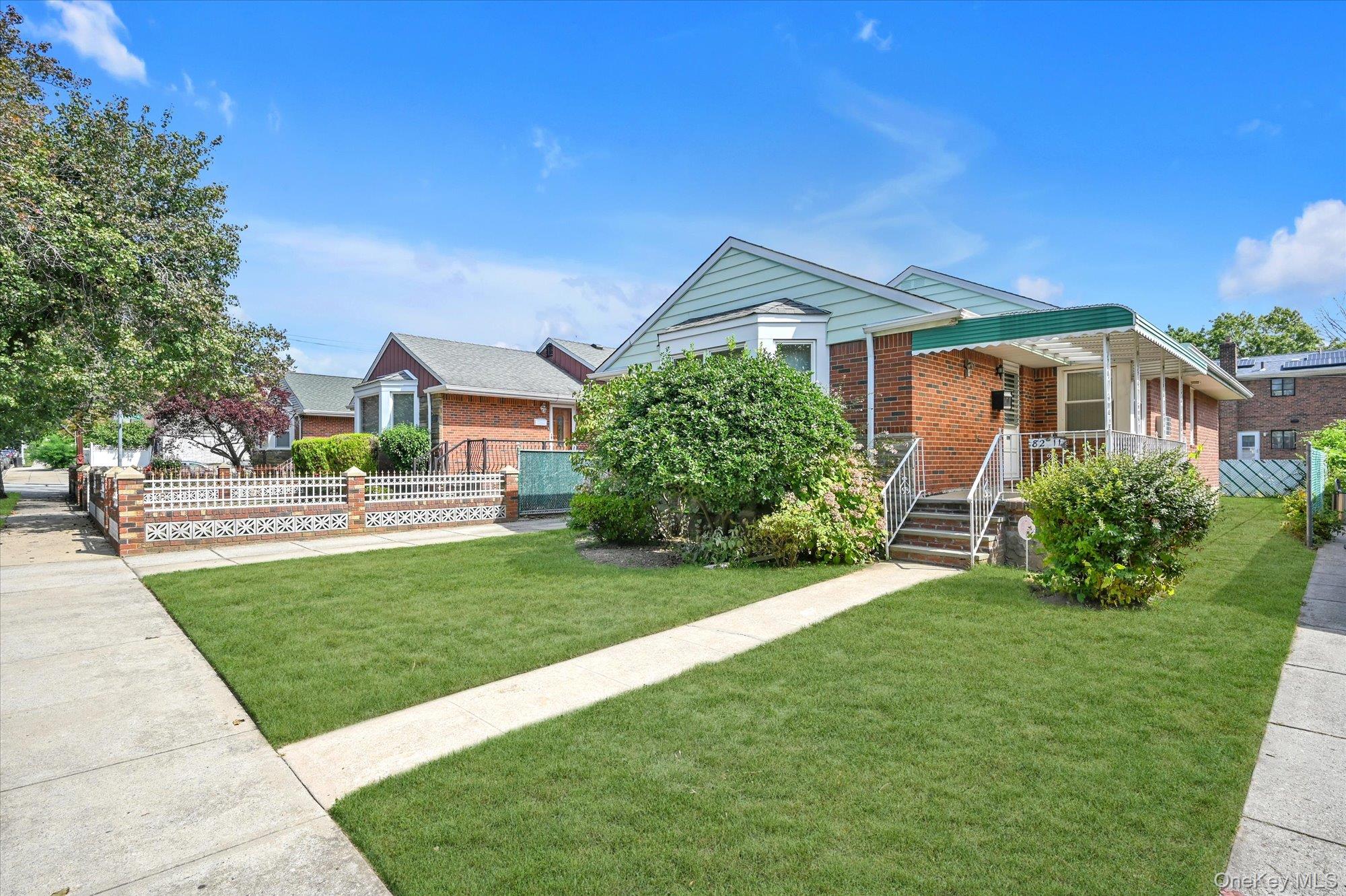 Welcome to this beautifully maintained ranch-style home located in the desirable neighborhood of Bellerose Manor, Queens. This home features a primary bedroom with an en suite full bathroom for a total of 3 bedrooms and 2 full bathrooms. Beautiful spacious living room, formal dining room and updated eat-in-kitchen. A full finished basement with huge recreation area, laundry-utility room and separate outside entrance. Enjoy the convenience of a private driveway, one car garage and a fenced backyard perfect for entertaining or relaxing. This property is near Alley Pond Park, public transportation, schools, shopping and so much more.