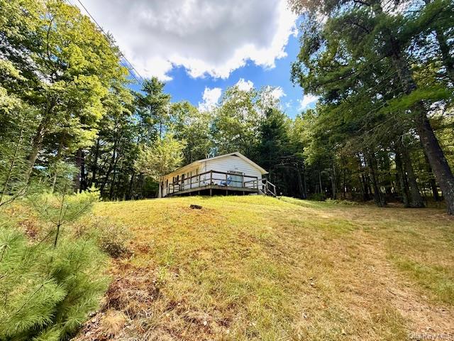 Great opportunity to purchase a home in Glen Spey NY situated on over 1 acre. This lovely corner lot is a great location with fabulous lake views. Relax and enjoy this beautiful corner property on your wrap around deck! Enter the home into a Large open living area with free standing wood stove, picture window and 2 amazing skylights adding additional light. Home features open living space, kitchen and dining area, 3 bedrooms and bath. Needs a bit of TLC so roll up your sleeves and complete the renovation process. Owner says bones are good, roof is good, structure is good, septic and well are good so generally all the work you need to do is cosmetic. Add the floors of your choice, paint colors of your choice and the renovations you&rsquo;d like to see. You can make this home your home sweet home! Only 2 hrs. NYC and within 30 minutes to all area conveniences and amenities including commuter trains and buses, . Don&rsquo;t miss this opportunity to make your home ownership dreams come true!
