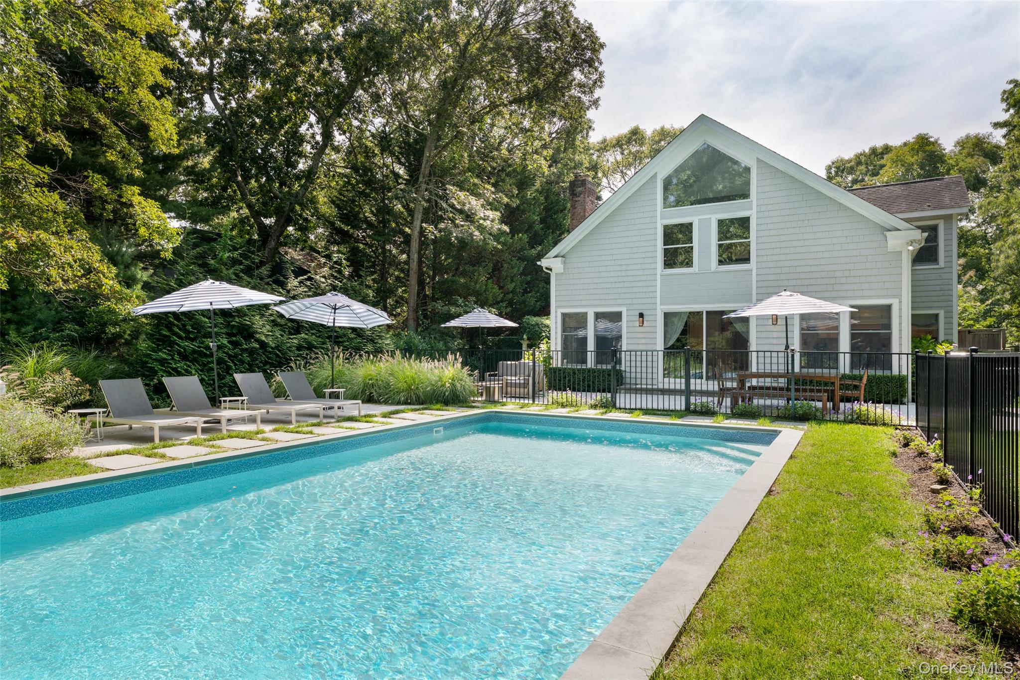 Nestled in the heart of East Hampton, this impeccably maintained, and thoughtfully renovated residence offers the perfect blend of comfort, style, and convenience. Whether you&rsquo;re seeking a serene year-round home or a luxurious summer escape, this property is ready to welcome you. Step into a sun-drenched, open-concept living space that seamlessly connects to the expansive backyard, featuring a heated in-ground pool and lush landscaping-ideal for entertaining or relaxing in privacy. Just minutes from Three Mile Harbor, Sammy&rsquo;s Beach, and over 17 acres of preserved natural beauty, this home places you at the center of everything the Hamptons lifestyle has to offer. The first floor boasts two spacious, well-appointed bedrooms and a full bath, providing ample accommodations for family and guests. Upstairs, the oversized owner&rsquo;s suite offers a private sanctuary with generous proportions and tranquil views. Conveniently located just 10 minutes from East Hampton Village, with its charming shops, fine dining, and cultural attractions, this property combines peaceful living with easy access to vibrant amenities.