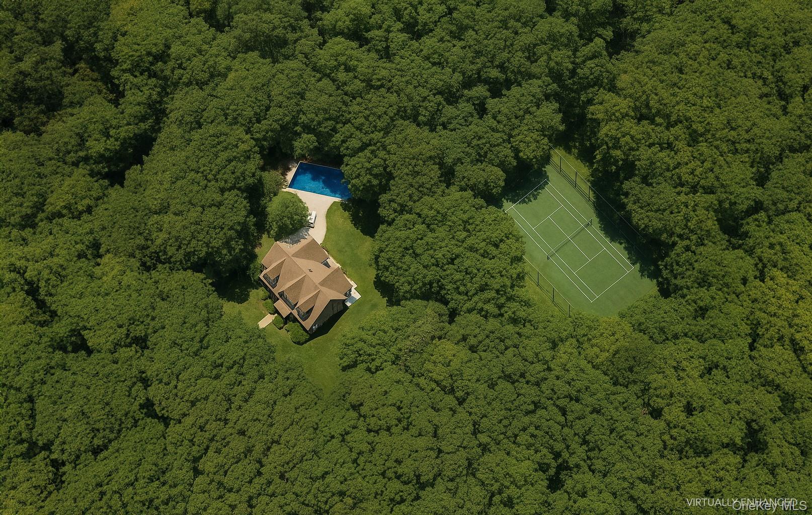 A truly rare offering in East Hampton&rsquo;s coveted Northwest Woods, this gracious gabled traditional sits on 5.1 pristine acres directly bordering 250+ acres of forever-preserved land: a unique opportunity to enjoy unmatched privacy and a natural sanctuary setting that can never be duplicated. One of the largest parcel lots still intact adjacent to the preserve . Fully renovated in 2020, the 3, 900+/- sq. ft. residence balances classic Hamptons architecture with modern comforts. The home features 4 bedrooms and 3.5 baths, including two luxurious primary suites, one on the main level and another upstairs. Enter through a grand foyer that flows into a soaring 24 ft cathedral height living room, where floor-to-ceiling windows frame views of the estate grounds and a stately fireplace anchors the space. The chef&rsquo;s eat-in kitchen is appointed with new stainless steel appliances, a sunlit breakfast area, and is complemented by a formal dining room for elegant entertaining. The first-floor primary suite is a private retreat, complete with a spa-inspired bath featuring a soaking tub and double shower, plus a covered porch overlooking the backyard and tennis court. Upstairs, the second primary suite is equally refined, joined by two guest bedrooms and a beautifully appointed shared bath. Outdoors, indulge in the best of Hamptons living with a sun soaked private pool, all-weather tennis court, and multiple porches and patios ideal for entertaining or quiet relaxation. The expansive acreage also presents a rare opportunity to enhance, build, or expand, with ample room to create a truly world-class compound. Surrounded by nature, quiet and peace yet less than 9 minutes from the bay&rsquo;s main beaches, renowned restaurants, East Hampton Village, and world-class ocean town beaches, this property offers a lifestyle of serenity, exclusivity, and convenience - an exceptional find that rarely comes to market.