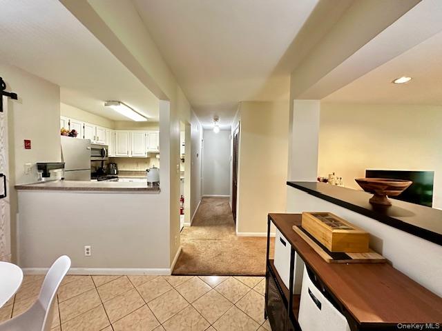 Welcome to Buttonwood Hill Condominiums! This first-floor 2-bedroom, 2-bath unit offers easy living with a private feel. The open layout features a spacious living and dining area that flows to a walk-out patio overlooking the woods â€” the perfect spot for morning coffee or evening relaxation. The kitchen provides ample storage and workspace, while the primary suite includes a full bath and generous closet space. A second bedroom and hall bath offer comfort for guests, family, or a home office. With its ground-level convenience and wooded backdrop, this condo balances accessibility and serenity. Ideally located near shopping, dining, parks, and commuter routes, 302 Concord Lane is ready for its next owner to make it home.