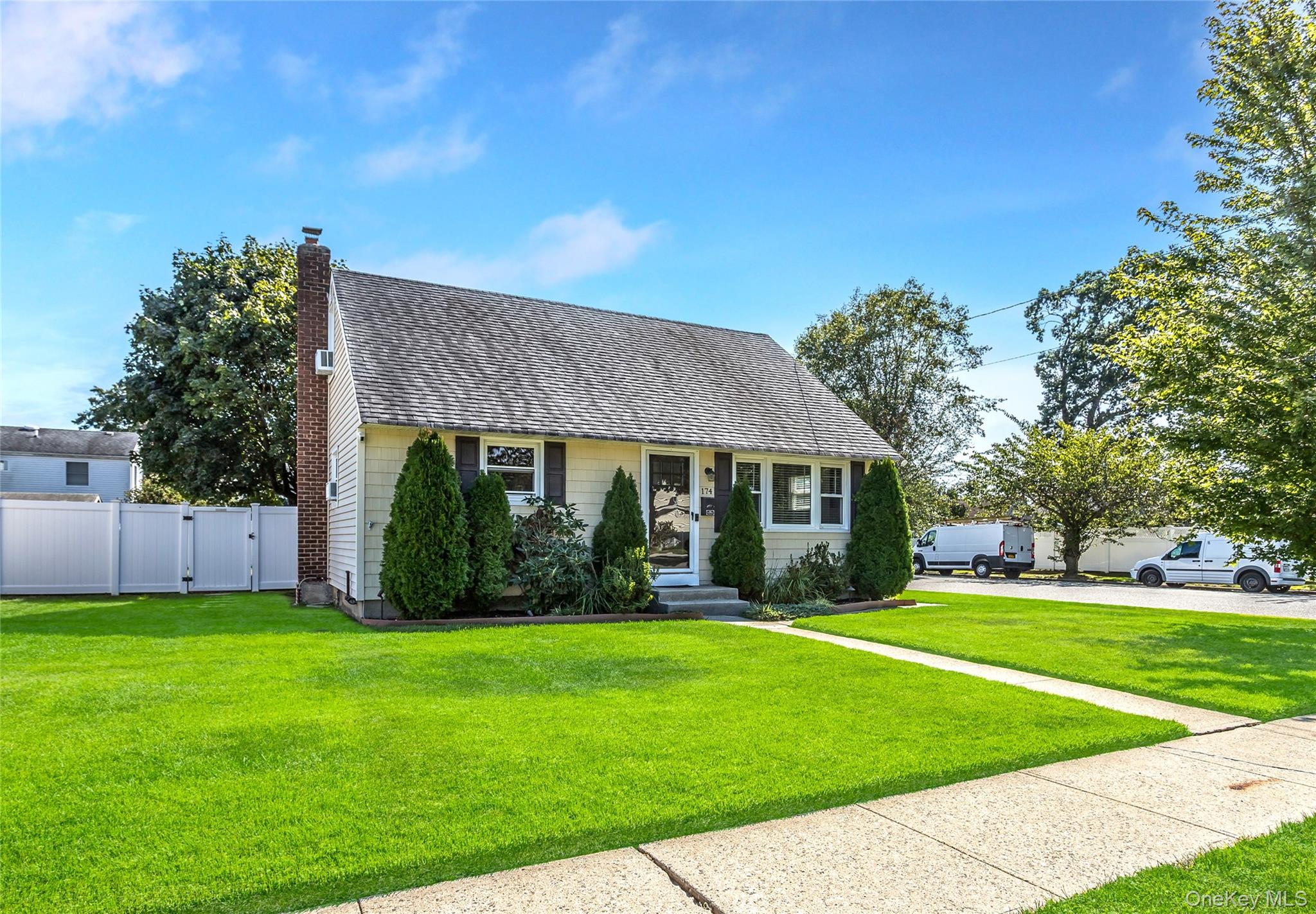 Delightful Cape on a Corner Lot with Pleasant Curb Appeal. 1st Floor is Nicely Updated with Newer Eat in Kitchen. High Ceiling Dining Room. Updated Bathroom in modern fashion with stylish accents. Primary Bedroom conveniently on 1st Floor. Fresh Living Room with Recessed Lighting Right off Main Entrance. Laundry on 1st Floor. Cozy Partially Finished Basement with additional Laundry Hook-up. Attached Garage with Additional Access Door. Entering the Rear of the home onto a wonderfully sized deck with a custom bench butting up to a quaint tree providing shade for daytime relaxation or entertaining guest. Fun sized yard with soft landscaping and great atmosphere. Close to public transportation, schools and shopping.