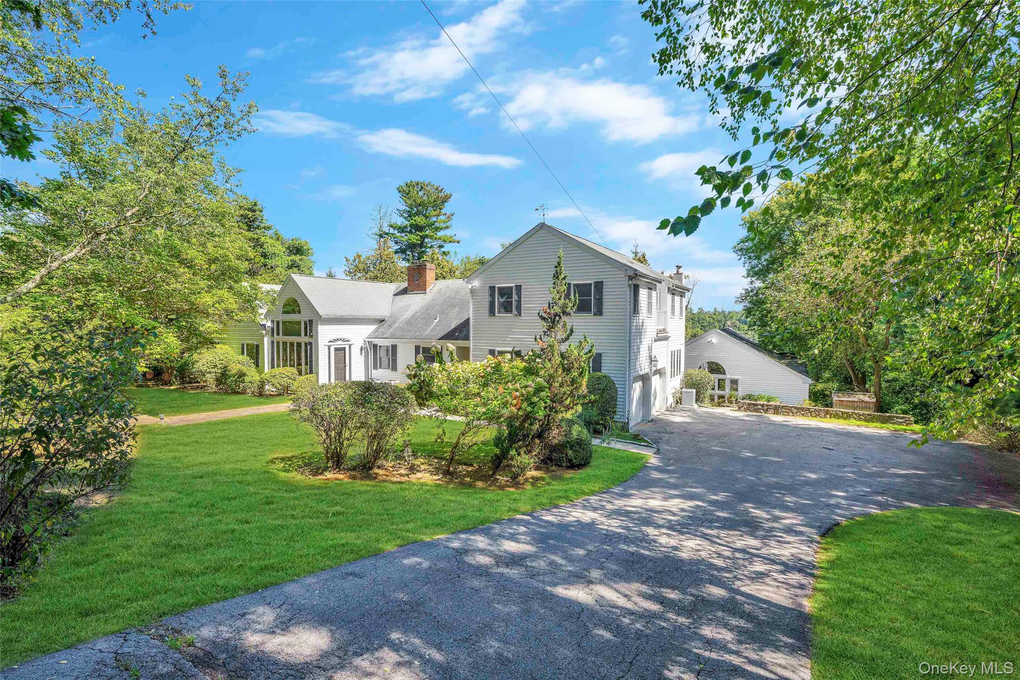 Nature Loverâ€™s Paradise â€“ Welcome to 55 Winding Rd Farm in Ardsley â€“ a charming and spacious 3, 402 sq. ft., 4-bedroom, 3 full, 2 half bath home with a 2-car garage set on a sprawling, private acre of land. Thoughtfully updated, this residence blends classic character with modern touches, offering comfortable living and effortless entertaining. Expansive and open flow layout includes a spacious living room with fireplace, dining room, and a cozy family room. Eat-in kitchen has been updated. The generously sized bedrooms include a serene primary bedroom and en-suite bath, walk-in closet and terrace. A private home office and separate entrance, den, powder room and second terrace. Outside, the lush yard offers space for gardening, play, or simply relaxing in nature. Located in the Ardsley school district, close to parks, shops, transportation, Greenburgh Rec and Hartsdale Train parking. A true retreat just 30 minutes from NYC!
