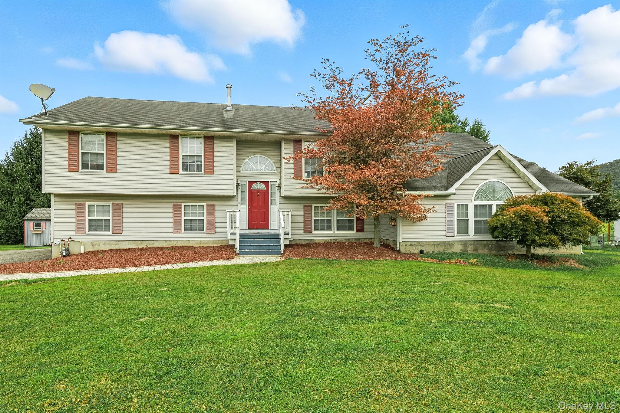 Unbelievable opportunity to own an extraordinary Mother Daughter or multi unit style property in the heart of Washingtonville. This home combines a spacious raised ranch with an impressive two story contemporary addition. Inside you will find gourmet kitchens with granite countertops and stainless steel appliances, vaulted ceilings, hardwood floors, and beautifully tiled baths. Offering five bedrooms and four bathrooms, the master suites are complete with walk in closets and spa style baths. The lower level features a large bedroom with private entrance and walk in closet, providing flexibility for guests or extended family. Additional highlights include two expansive decks, a huge family room with fireplace, a loft with sliders leading to a deck overlooking the Hudson Valley, two laundry areas, a landscaped fenced yard, and an above ground pool with its own private enclosure. Parking is convenient with an attached garage. With city water, city sewer, natural gas, central air, and Energy Star appliances, this home is move in ready and designed for comfort. Perfect for multi generational living or as an income producing multi unit property, this rare find will not last.