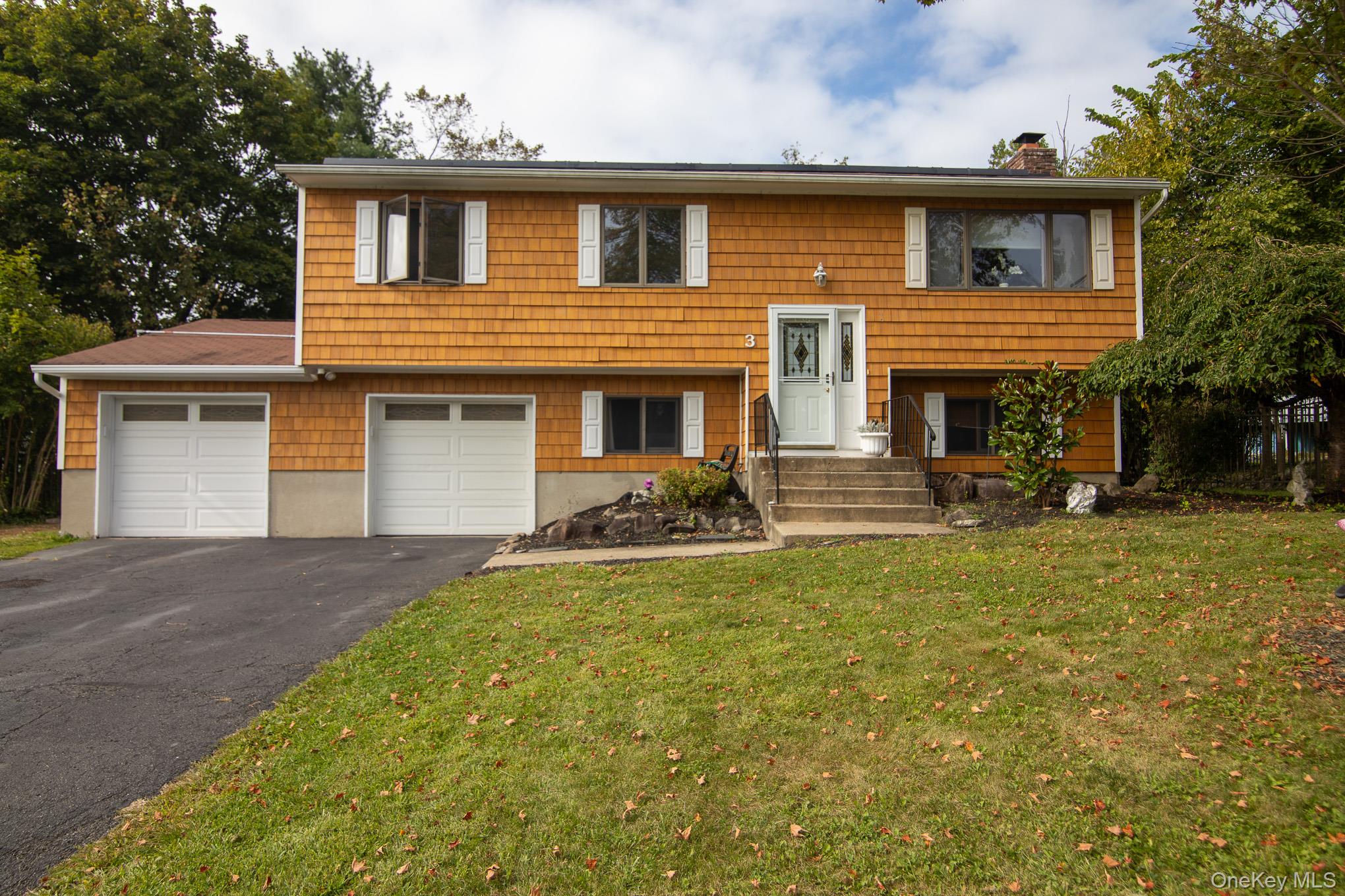Welcome to this 4-bedroom, 2 bath bi-level home located on a quiet cul-de-sac! Boasting 2, 000 sq. ft. of living space on 0.26 acres, this move-in-ready property offers comfort, style, and incredible updates throughout. The kitchen features custom cabinetry, granite countertops, built-in granite counter/table for additional seating, stainless steel appliances, and a pull-out pantry, perfect for cooking and entertaining. The main bath has a custom double-sink vanity, whirlpool tub, and laundry chute. Upstairs, enjoy a bright living room and dining area that flows seamlessly to the kitchen, while the lower level offers a spacious family room with a wood-burning fireplace, an additional den/office, a fourth bedroom, and a full recently updated tiled bathâ€”ideal for guests or a potential in-law setup. This solidly built home showcases Anderson windows, hardy plank siding, and hardwood floors throughout. Modern amenities include a high efficiency gas boiler, brand new central air, central vac, security system, and a two-car garage. The fenced-in backyard is an entertainerâ€™s dream with a double-deck (partial composite) that has scenic mountain views, and a 16x32 in-ground pool with heater and pool equipment included. Mature plantings for privacy. Scuttle attic located in primary bedroom closet and attic area with pull-down stairs located in the garage for extra storage space. Upgraded 200 amp electric (2020). Public water and sewer add convenience. This home offers the perfect blend of quality, comfort and charm in a sought-after location in the Washingtonville School District. Close to shopping, restaurants, highways, wineries, nature trails, and within walking distance to public park, etc. Come make this your home and explore what the beautiful Hudson Valley has to offer.