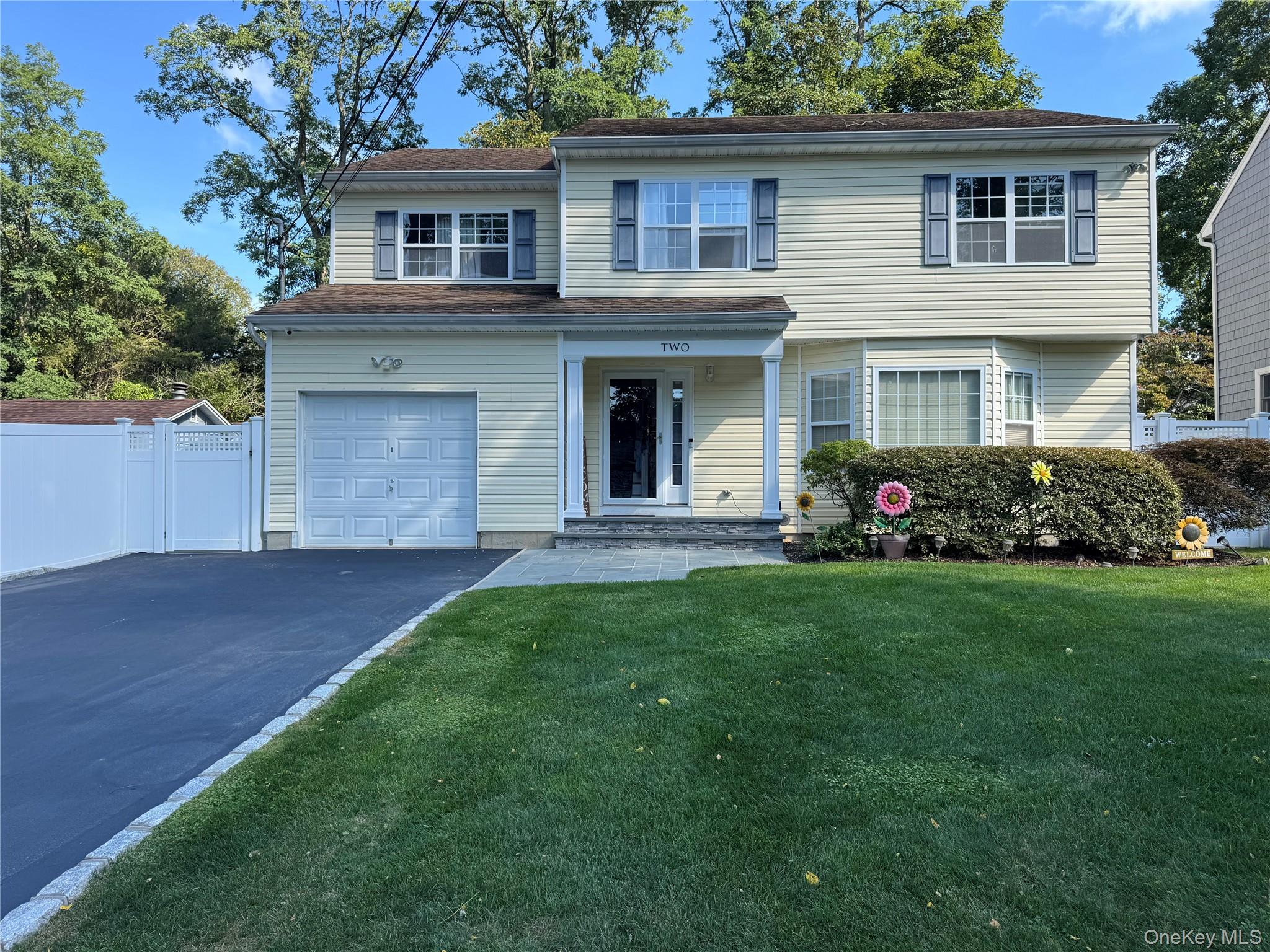 Welcome! To A Move In Ready Colonial, Updated 2024 Front Features Stunning Bluestone Pavers. Located In The Heart Of WEST HILLS Section Of Huntington. Light And Bright Entrance Foyer,  Leading To Open Concept Living Room and dining, All Updated Matte Hardwood Floors Through Out Home, The Kitchen Features Bright, Soft-White Cabinetry With Granite Counter Tops, Center Island With Seating, Wine Cooler, And Stainless Appliances. Leading Out Sliders To New Patio With Pavers Updated 2024. Second Level, Primary Bedroom With Tray Ceilings, Two Walk In Closets & Beautiful Full Bath. 3 Additional Oversized Bedrooms With Additional Full Bathroom On Second Bath, .CAC, 200 Amp Electric, 2 Zone Heating , Inground Sprinklers.
